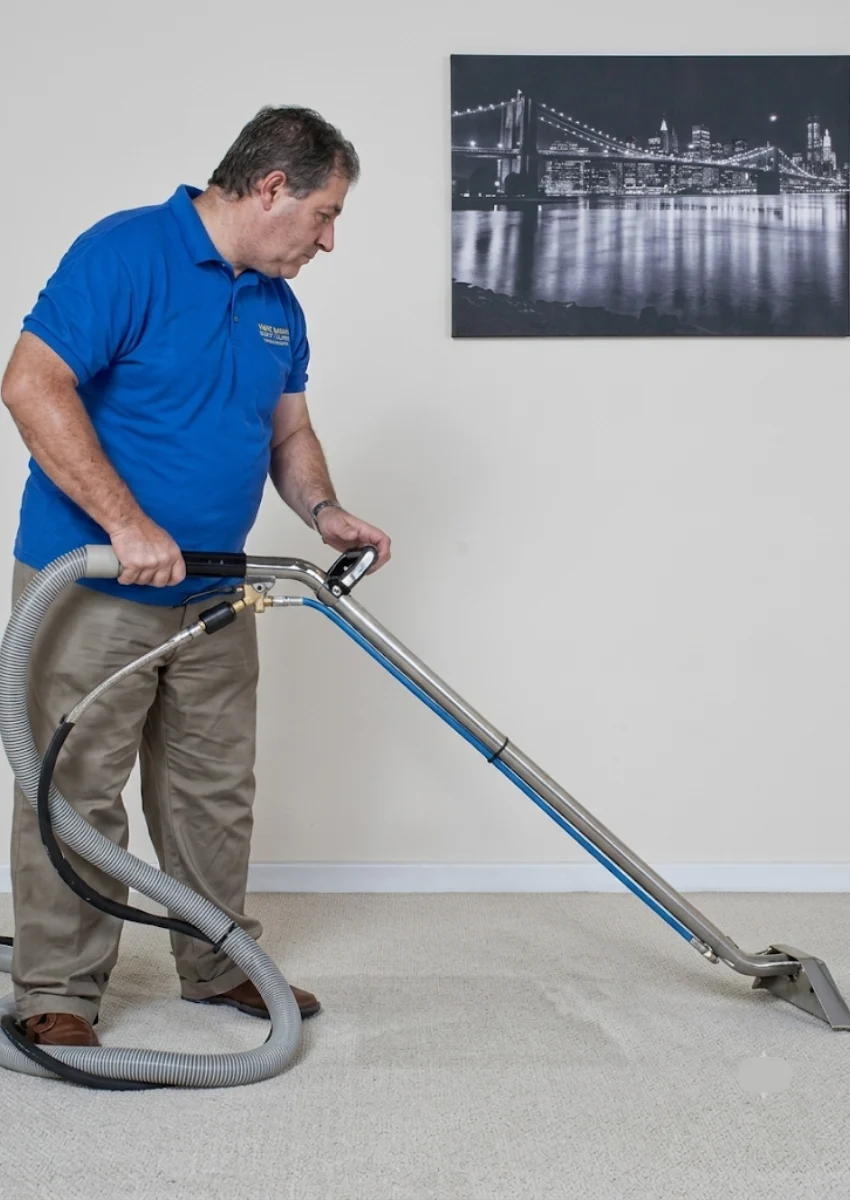 carpet cleaning page Man delivering carpet cleaning services